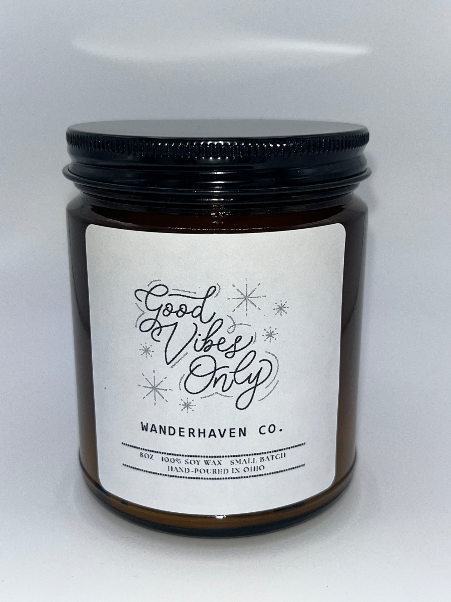 Candle jar with a label on a white background