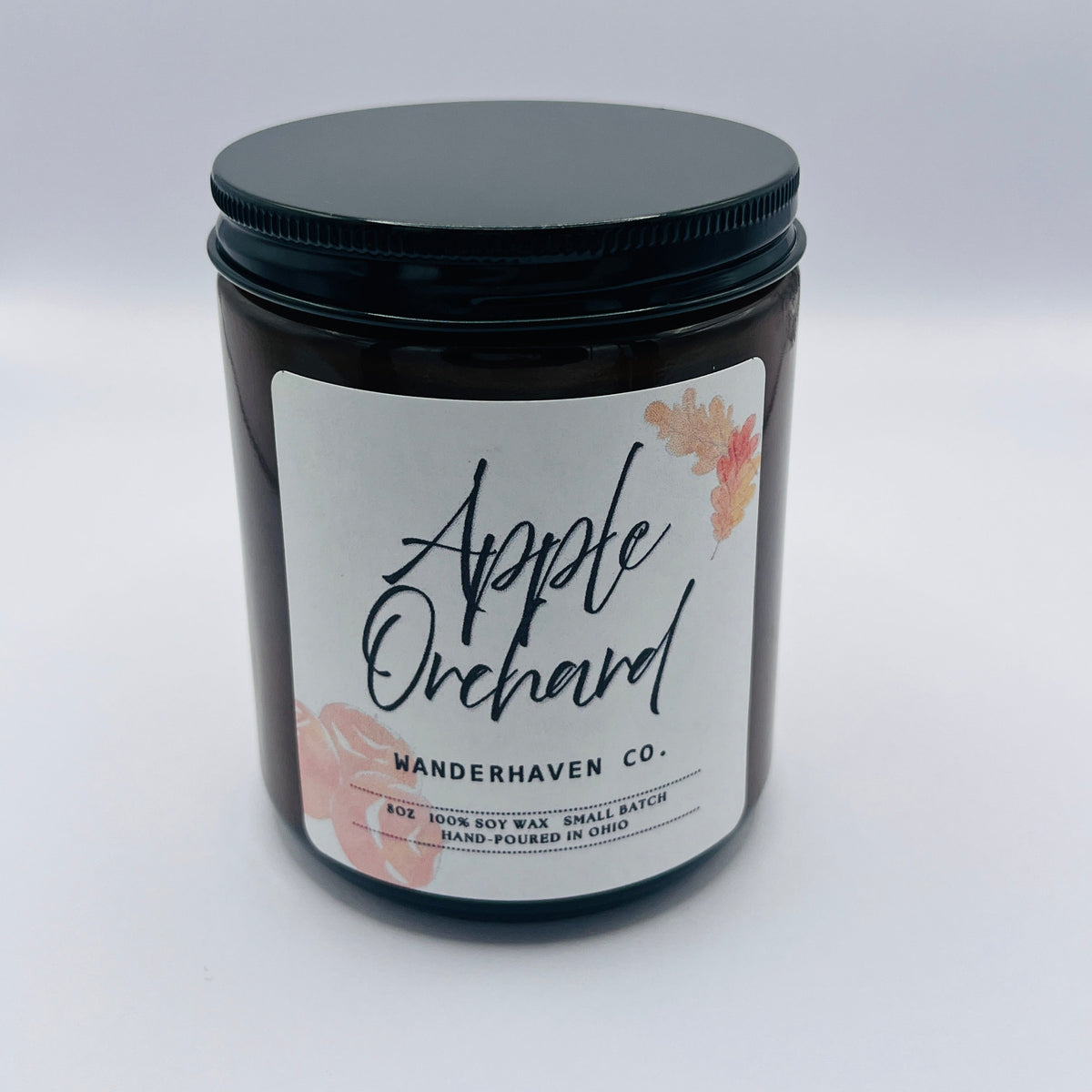 Apple orchard on a white label pictures of apples and autumn leaves int he background